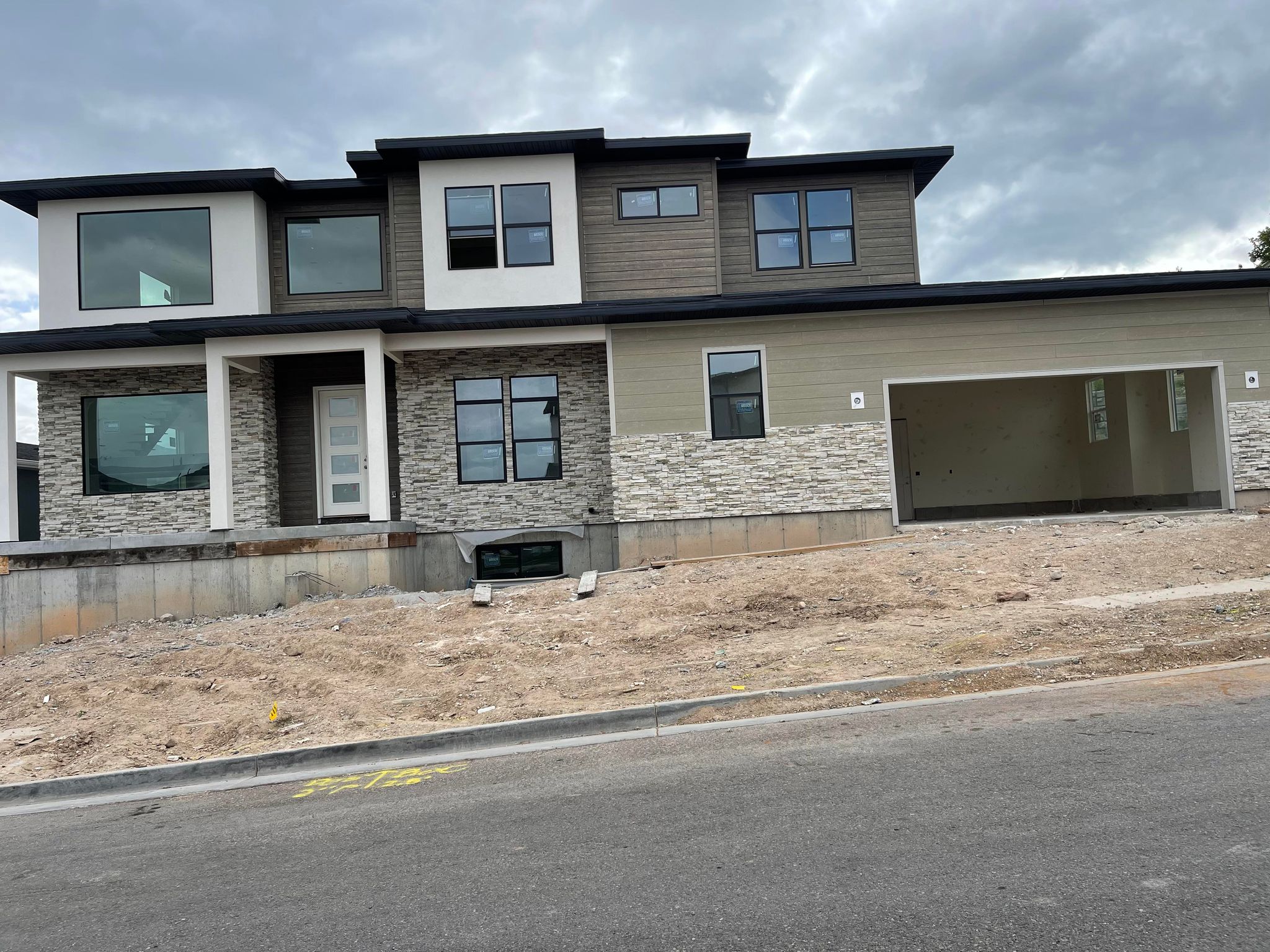Hardie siding and stone work on a home exterior